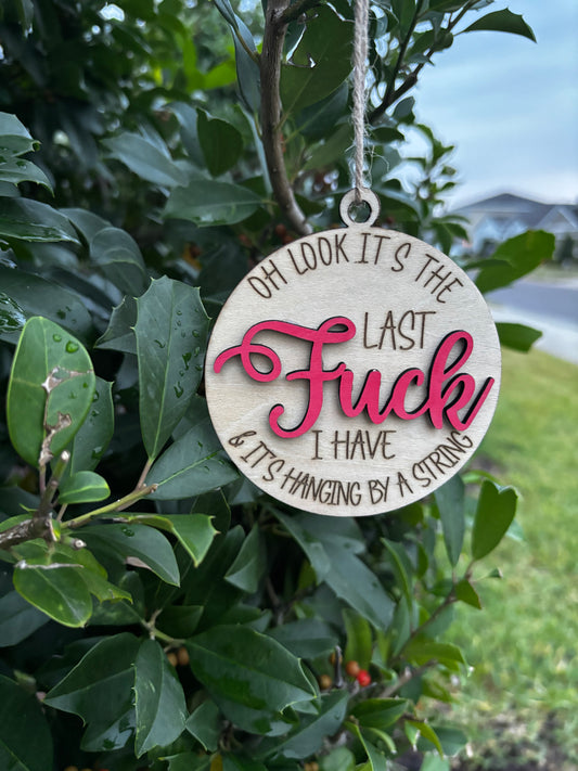 Hanging By A String Humor Ornament